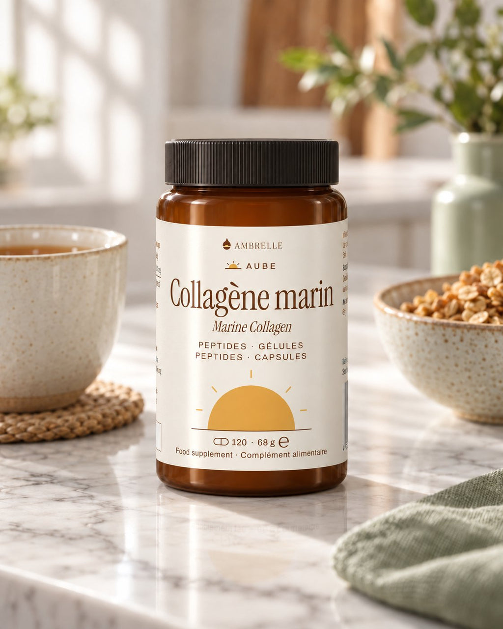 Marine Collagen Capsules by AMBRELLE on a marble kitchen counter at breakfast, next to a cup of tea