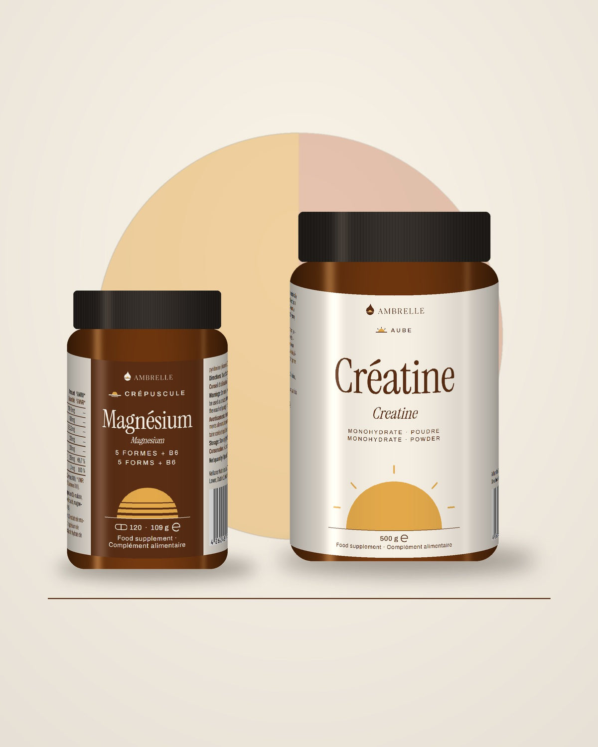 The Amber Hour Duo by AMBRELLE: 2 jars side by side in warm amber light
